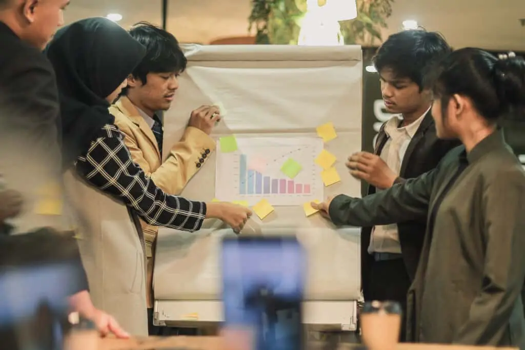 Group of business brainstorming goals and target